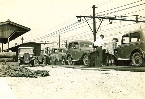 Datsun vehicles on a freight train